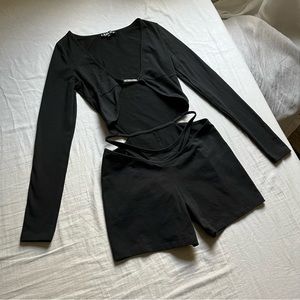 I AM GIA black cut out long sleeve knit romper